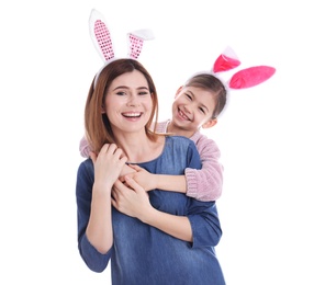 Happy woman and daughter with bunny ears on white background