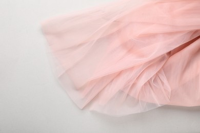 Photo of Beautiful tulle fabric on light grey background, top view