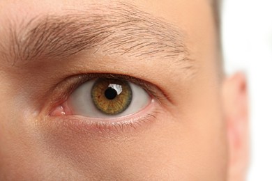 Photo of Closeup view of man with beautiful eye on blurred background
