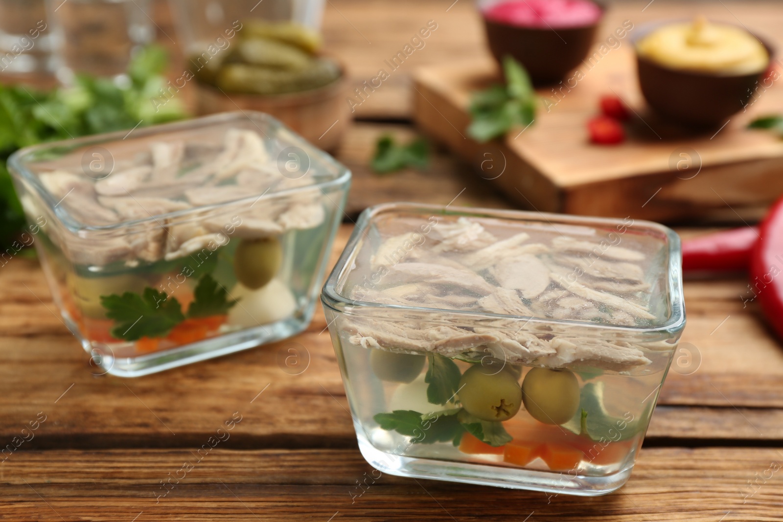 Photo of Delicious aspic with meat on wooden table