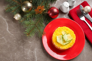 Photo of Flat lay composition with traditional russian salad Mimosa on marble table, space for text