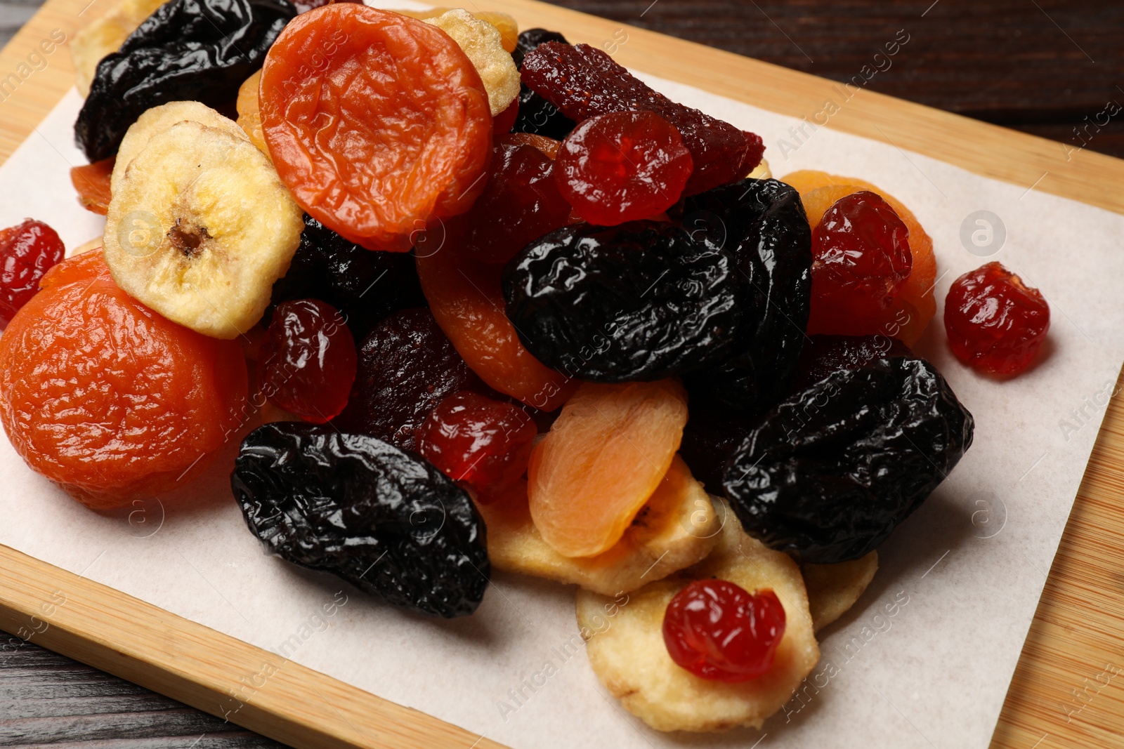 Photo of Mix of delicious dried fruits on table, closeup