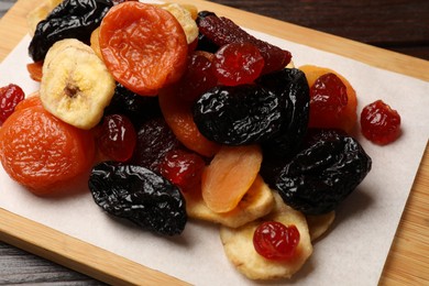 Mix of delicious dried fruits on table, closeup