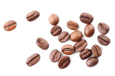 Many roasted coffee beans isolated on white, top view