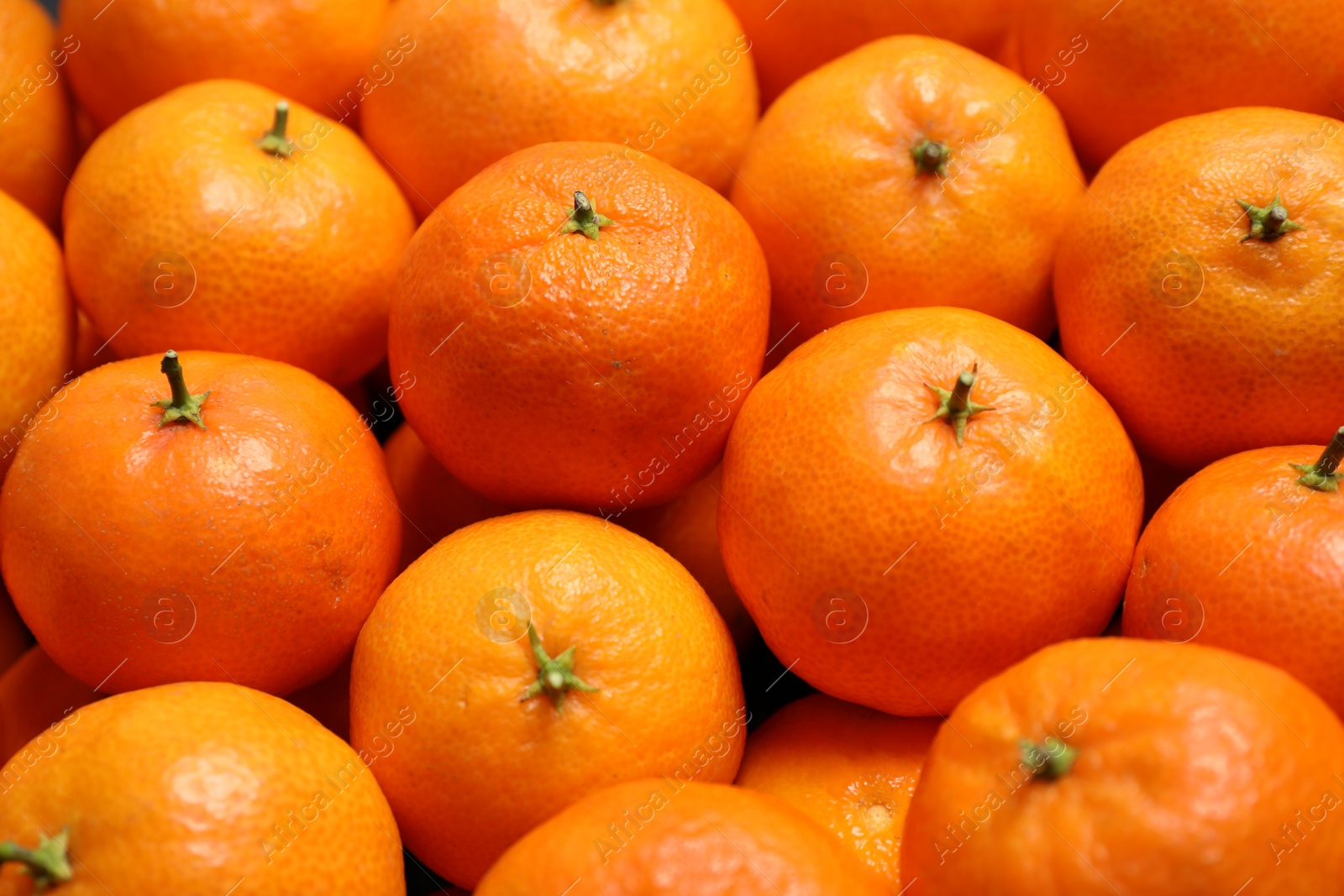 Photo of Delicious fresh ripe tangerines as background, closeup