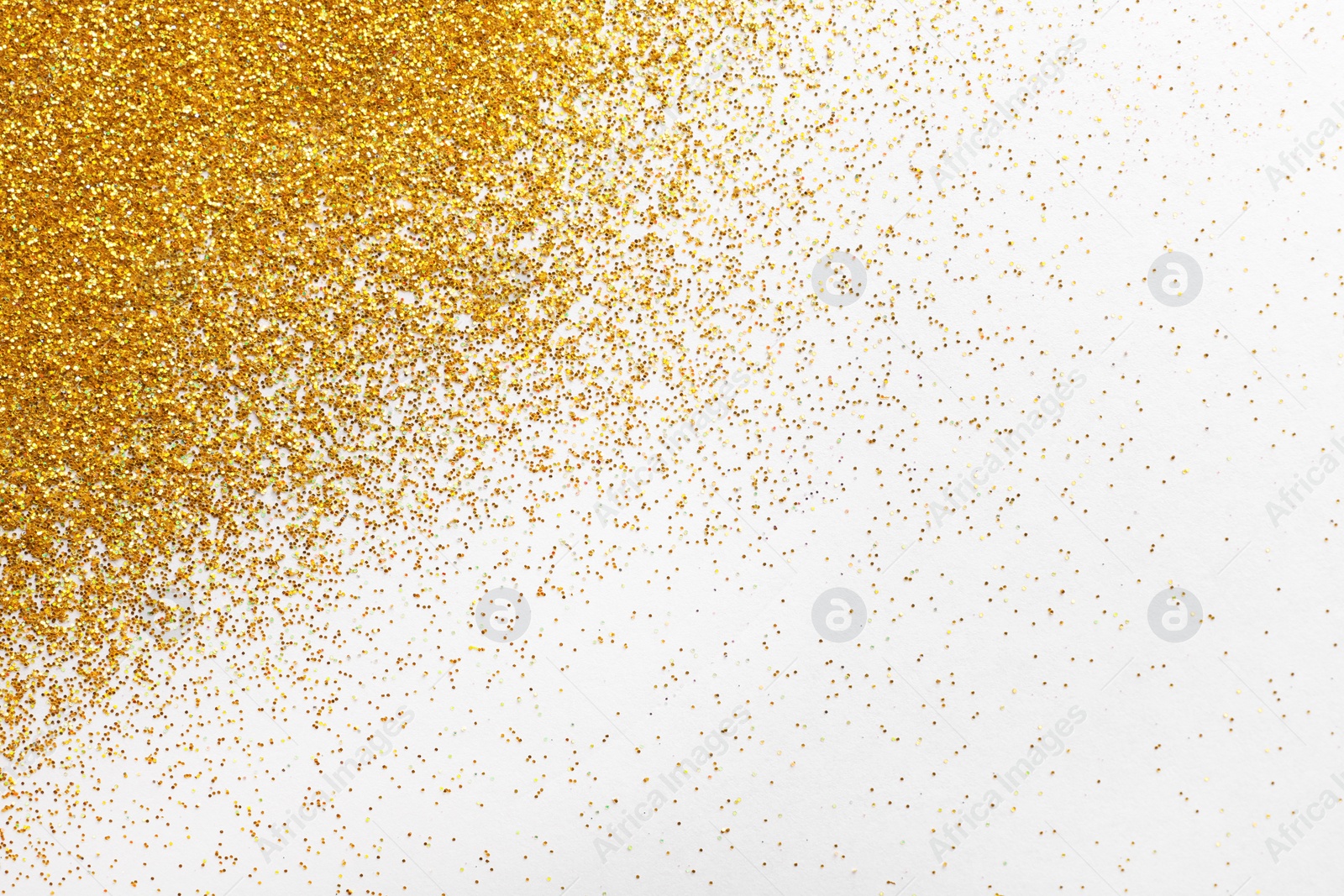 Photo of Golden glitter on white background, top view