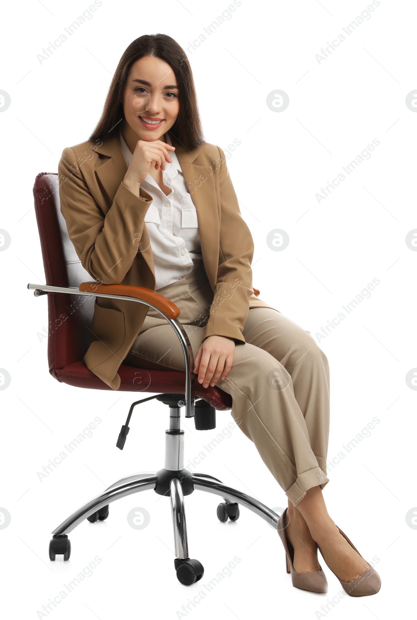 Photo of Young businesswoman sitting in comfortable office chair on white background