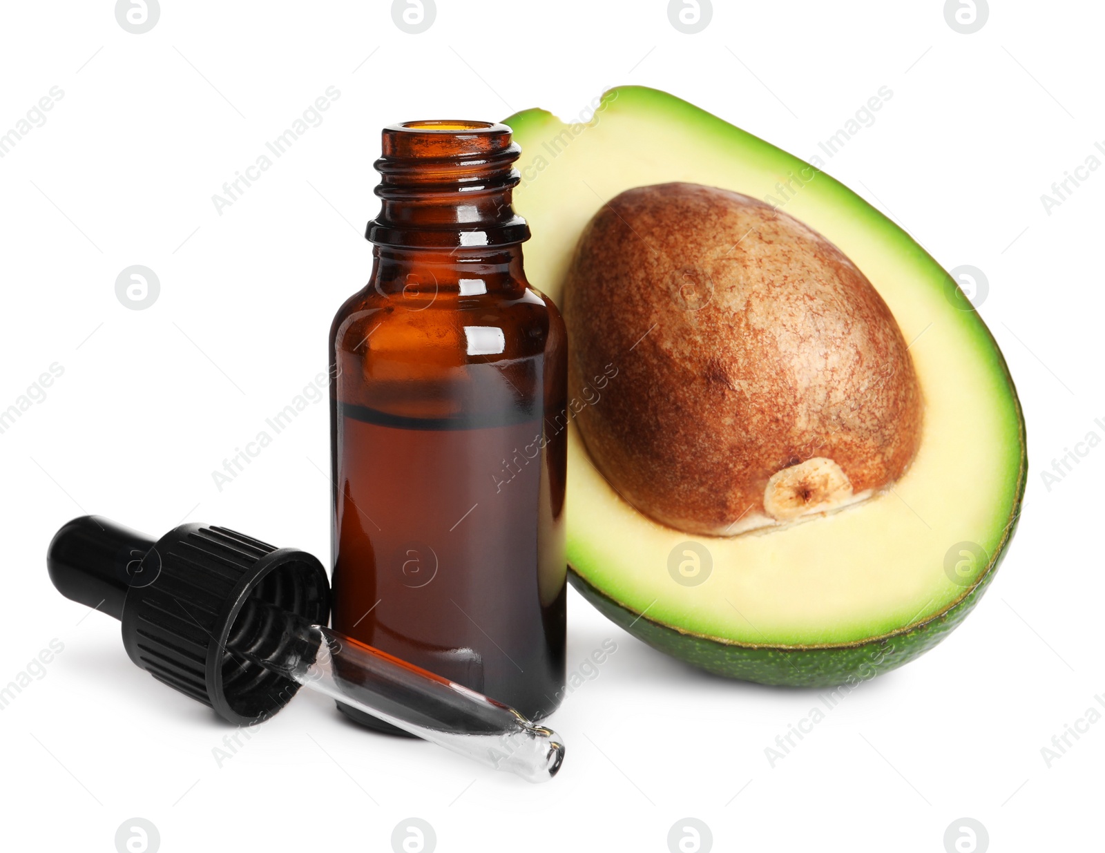 Photo of Cut avocado, bottle of essential oil and pipette on white background