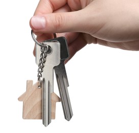 Photo of Woman holding keys with keychain in shapehouse isolated on white, closeup