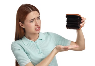 Upset woman with empty wallet on white background