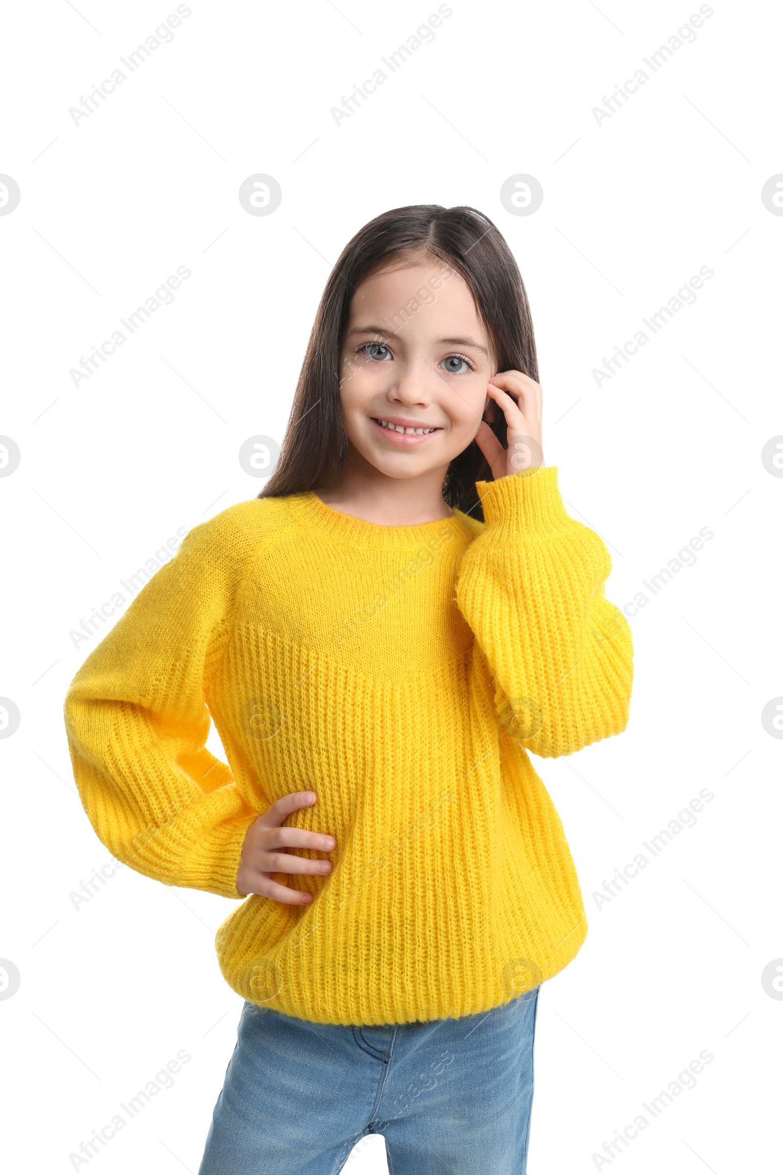 Photo of Cute little girl posing on white background
