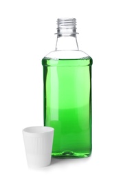 Photo of Bottle with mouthwash for teeth care on white background