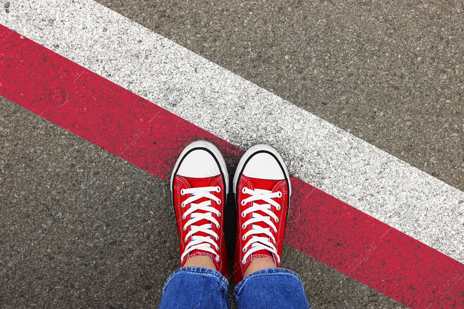 Image of Immigration. Woman standing on asphalt near flag of Poland, top view