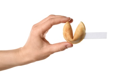 Photo of Woman holding traditional fortune cookie with prediction on white background, closeup