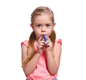 Photo of Birthday celebration. Cute little girl with blower on white background