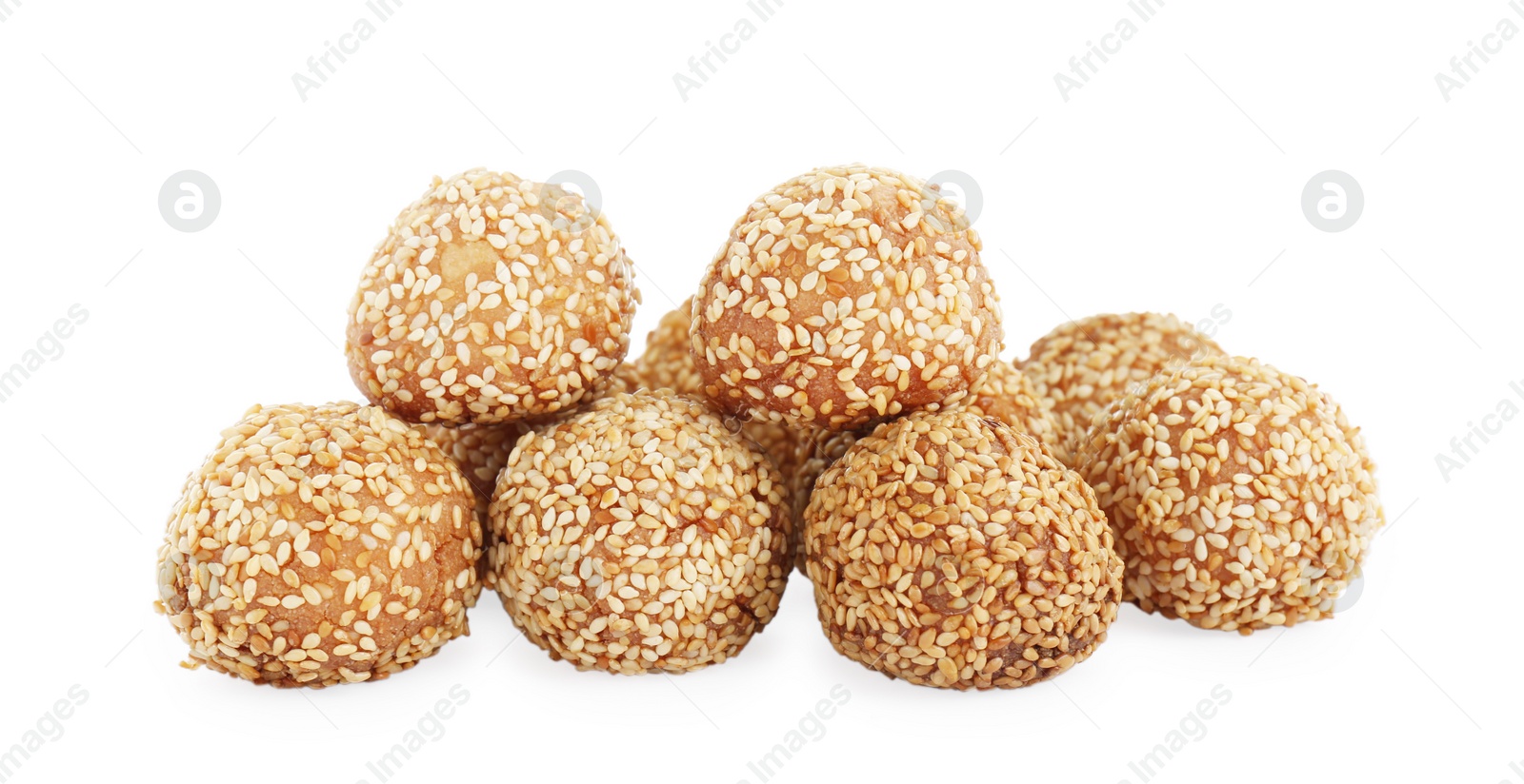 Photo of Many delicious sesame balls on white background