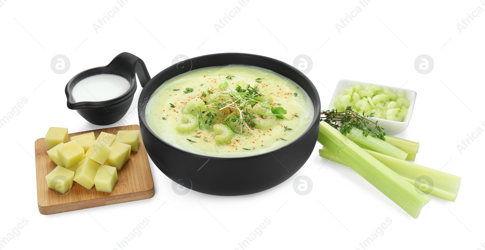 Photo of Bowl of delicious celery soup and ingredients isolated on white