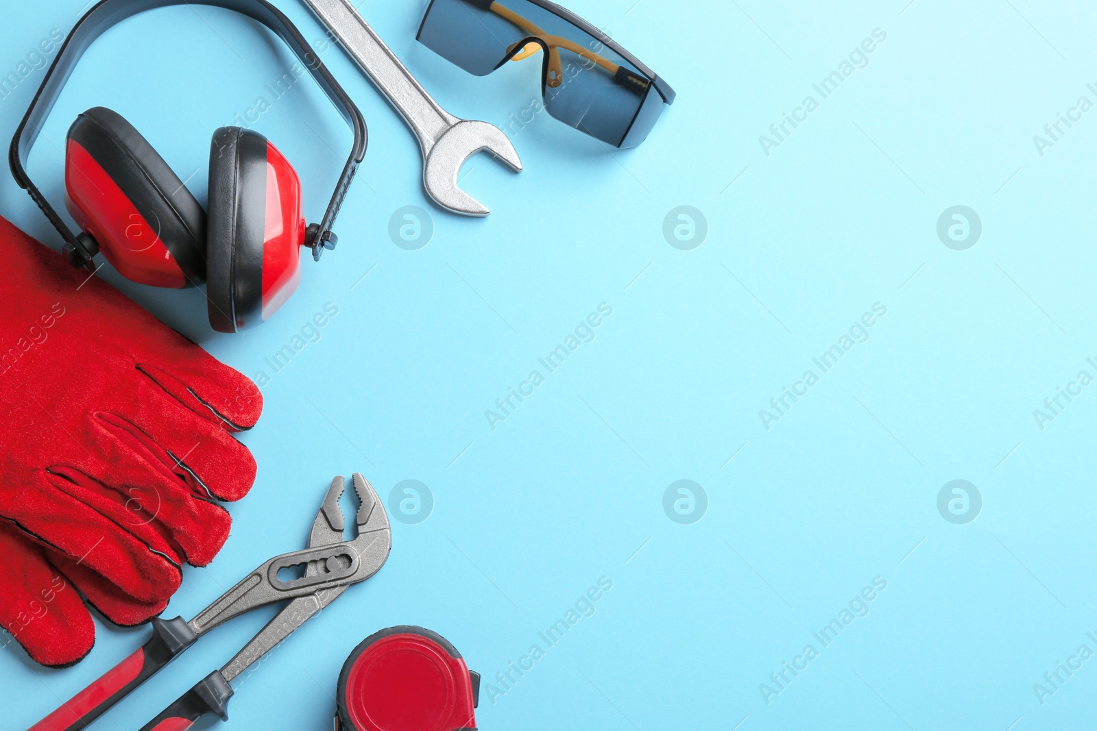 Photo of Flat lay composition with construction tools on color background, space for text