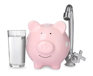 Photo of Water scarcity concept. Piggy bank, tap and glass of drink on white background