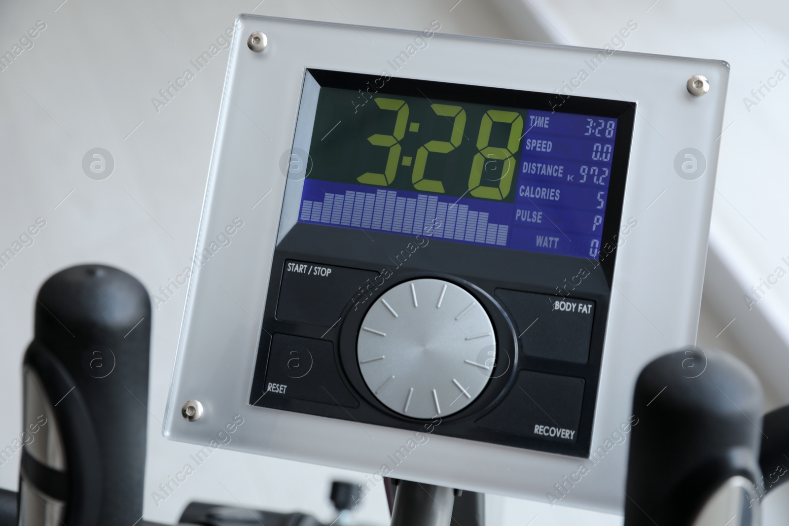 Photo of Control panel of modern elliptical machine cross trainer on blurred background