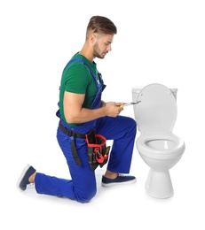 Photo of Young man working with toilet bowl, isolated on white