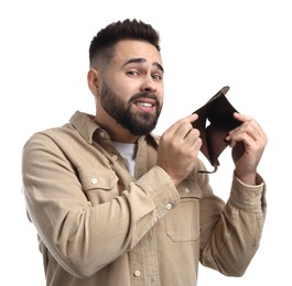 Confused man showing empty wallet on white background