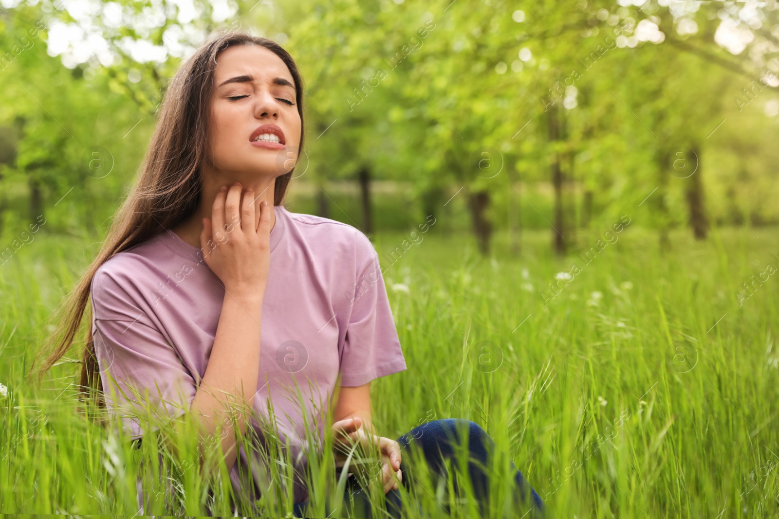Photo of Young woman scratching neck outdoors, space for text. Seasonal allergy