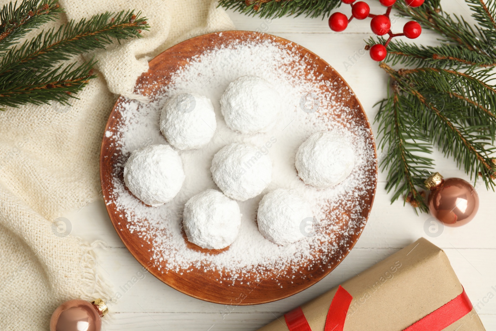 Photo of Flat lay composition with tasty Christmas snowball cookies on white table