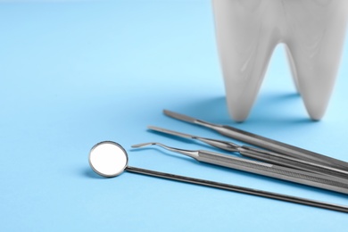 Set of dentist tools on color background. Space for text