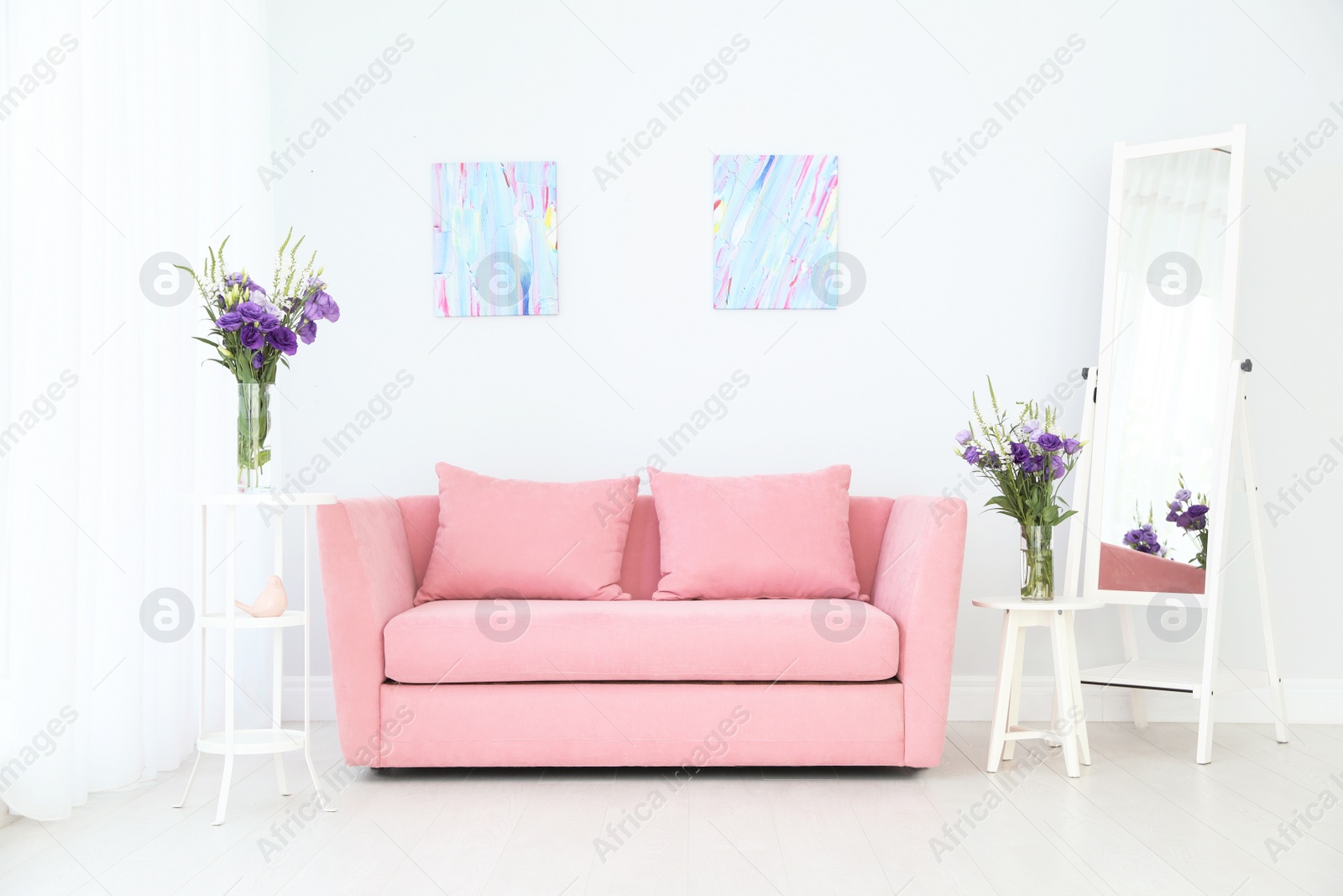 Photo of Modern interior of living room with comfortable sofa near white wall