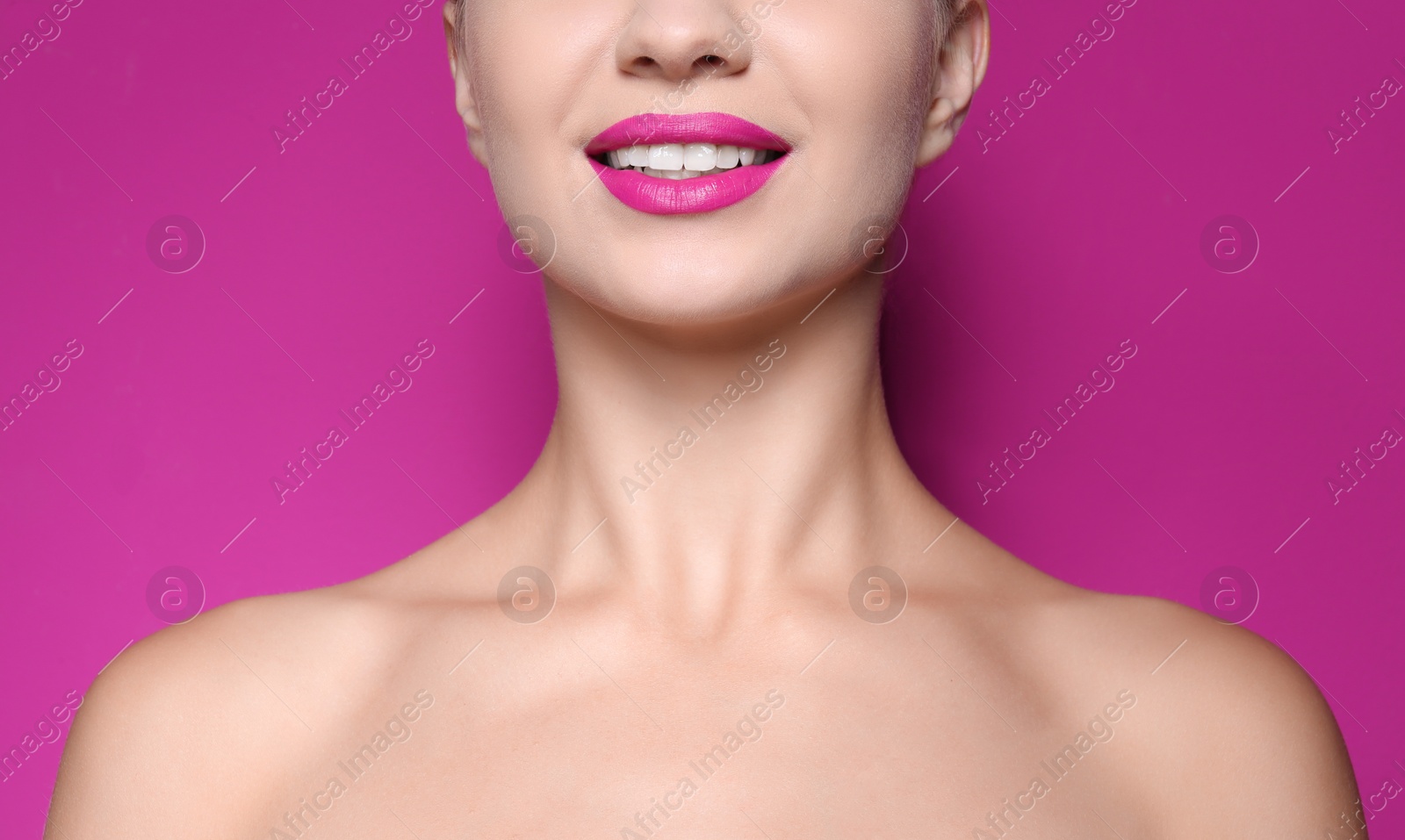 Photo of Beautiful young woman with perfect lips makeup on color background, closeup