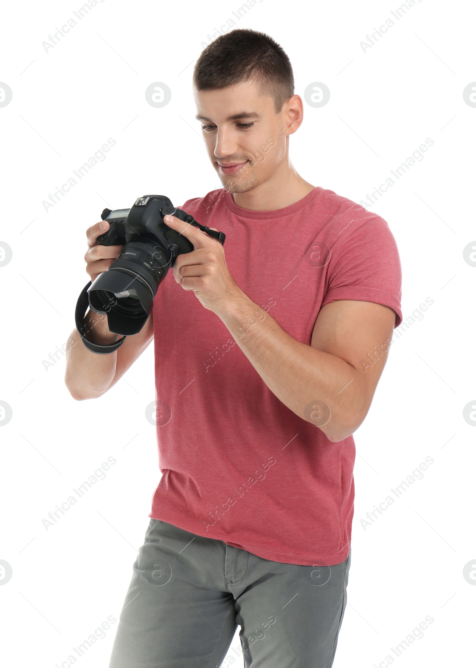 Photo of Young photographer with professional camera on white background