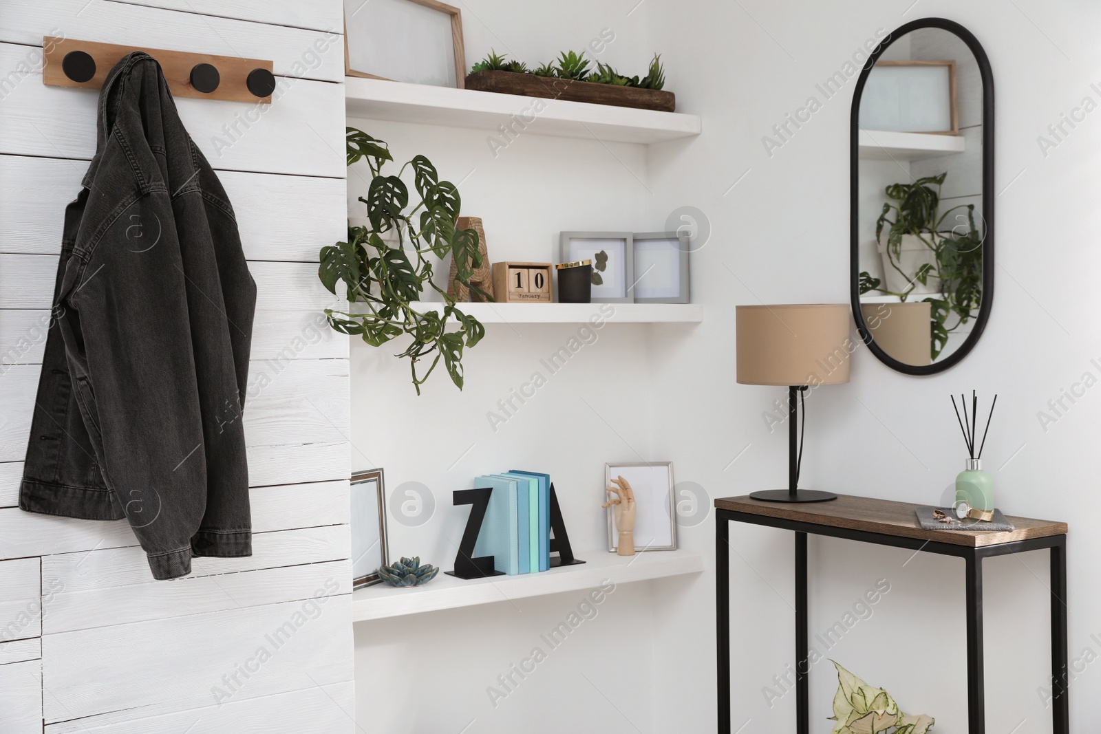 Photo of Hallway interior with console table and stylish decor