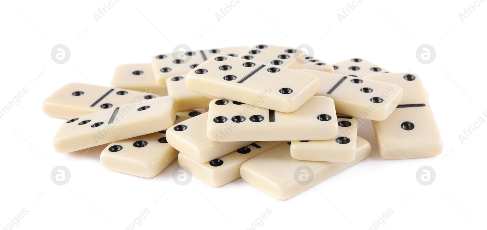 Photo of Pile of classic domino tiles on white background