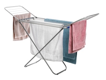 Photo of Modern drying rack with towels on white background