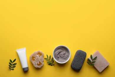 Photo of Flat lay composition with pumice stone on yellow background. Space for text