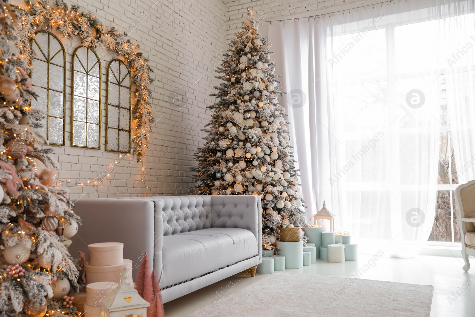 Photo of Beautiful interior of living room with decorated Christmas trees