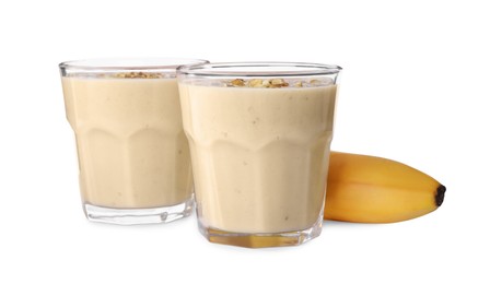 Photo of Tasty banana smoothie with almond and fresh fruit on white background