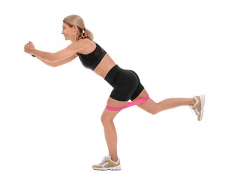 Woman exercising with elastic resistance band on white background