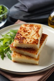 Photo of Delicious turnip cake with arugula served on table
