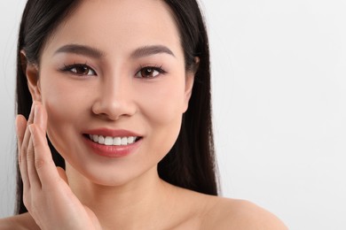 Portrait of beautiful woman on white background