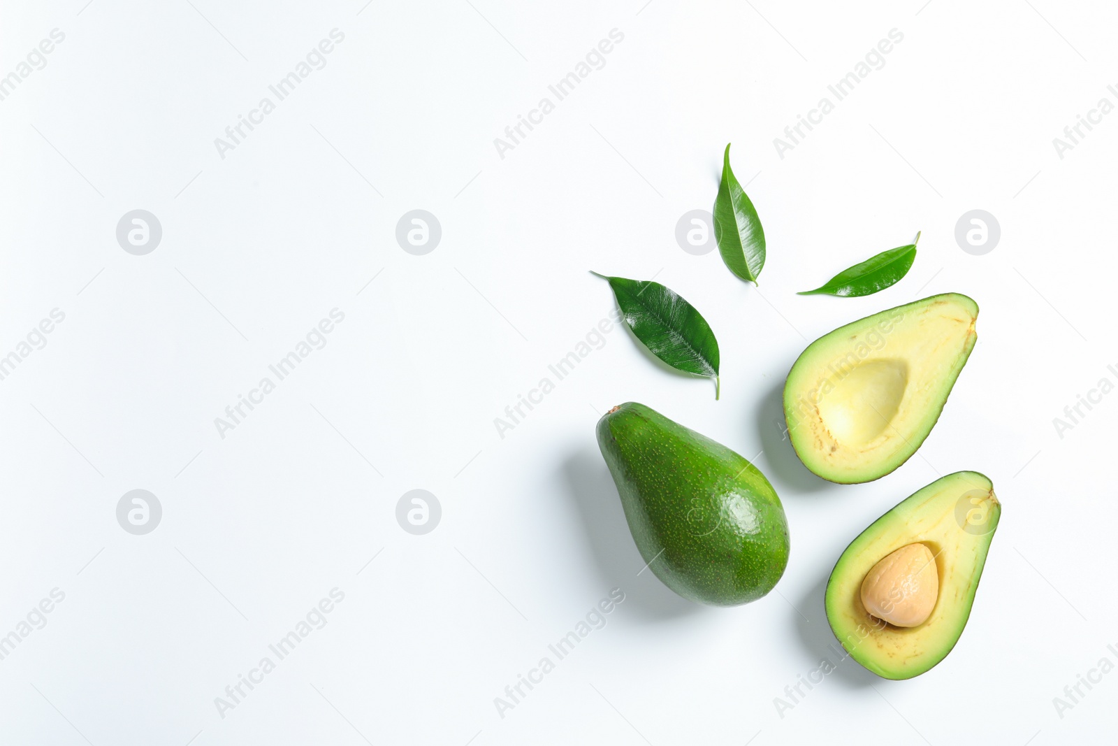 Photo of Composition with ripe fresh avocados on white background