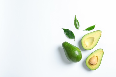 Composition with ripe fresh avocados on white background