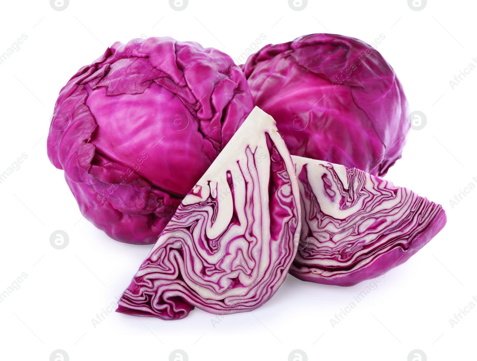 Photo of Whole and cut red cabbages on white background