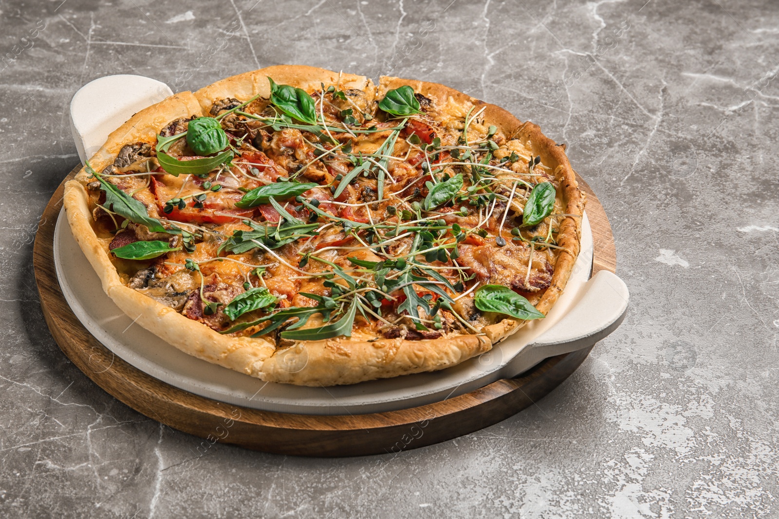 Photo of Tasty fresh homemade pizza on grey background