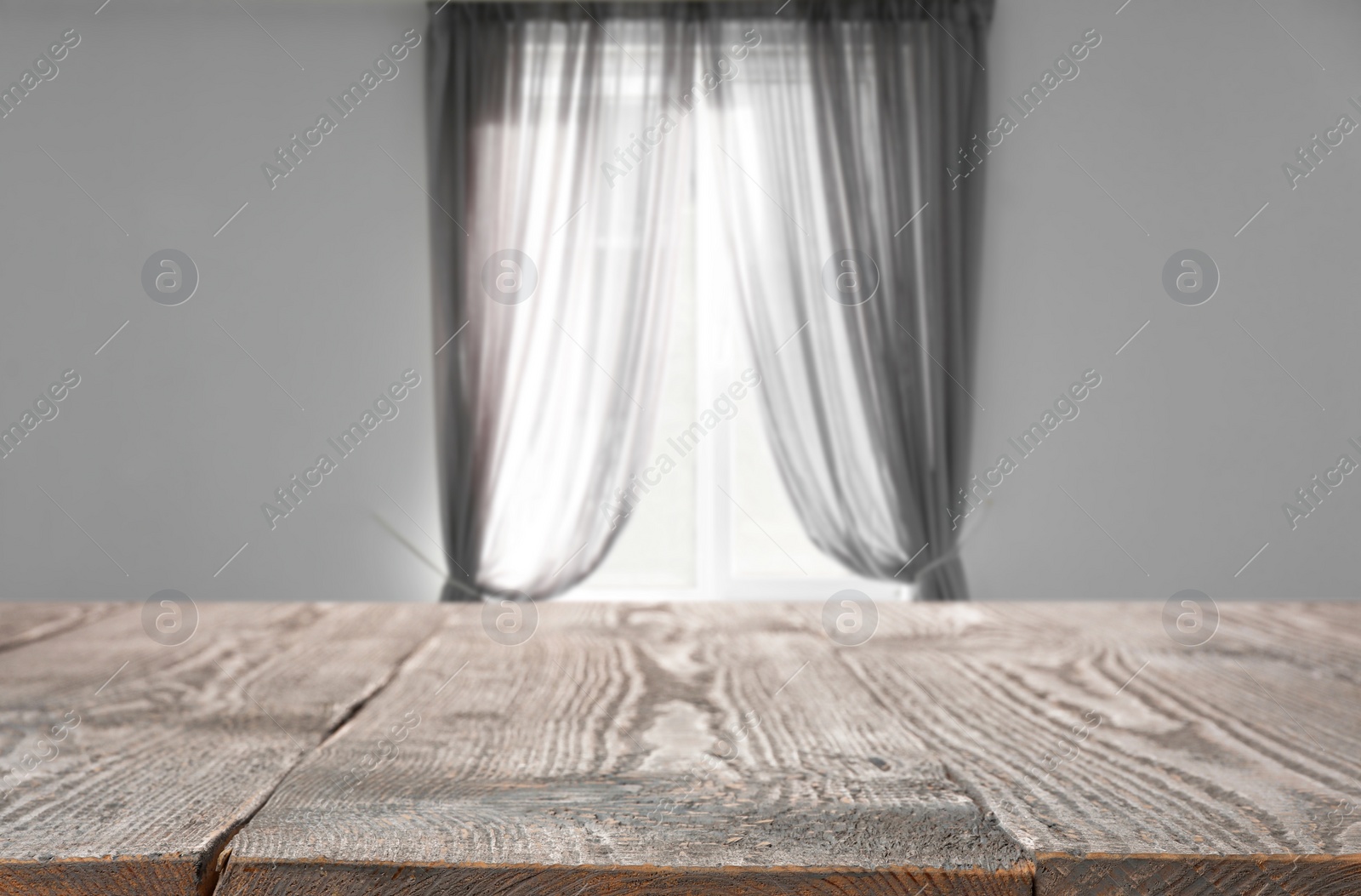 Image of Empty wooden table in room. Space for design