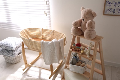 Photo of Decorative ladder with toys and different stuff in stylish baby room. Idea for interior design