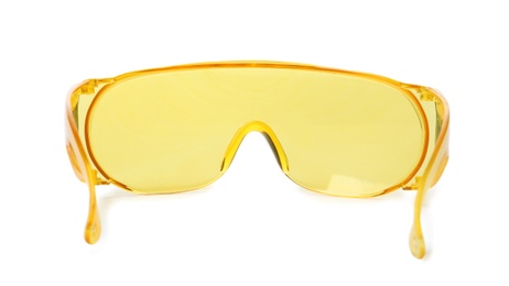 Protective goggles on white background. Construction tool