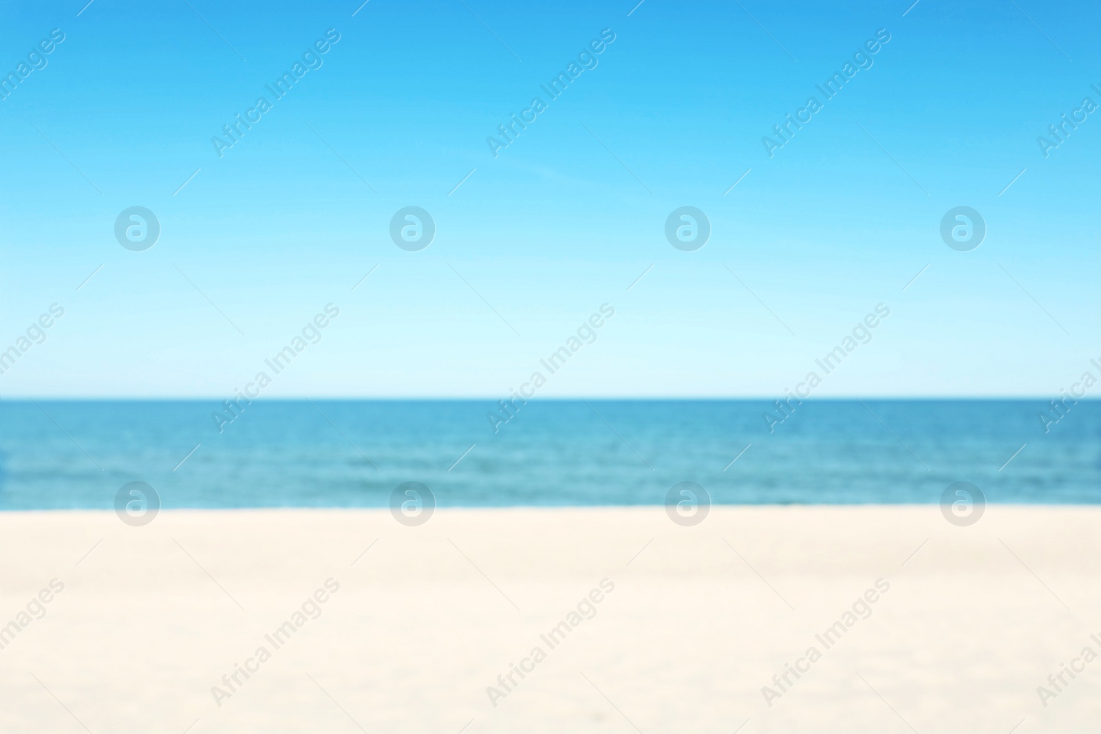 Photo of Blurred view of sandy beach near sea