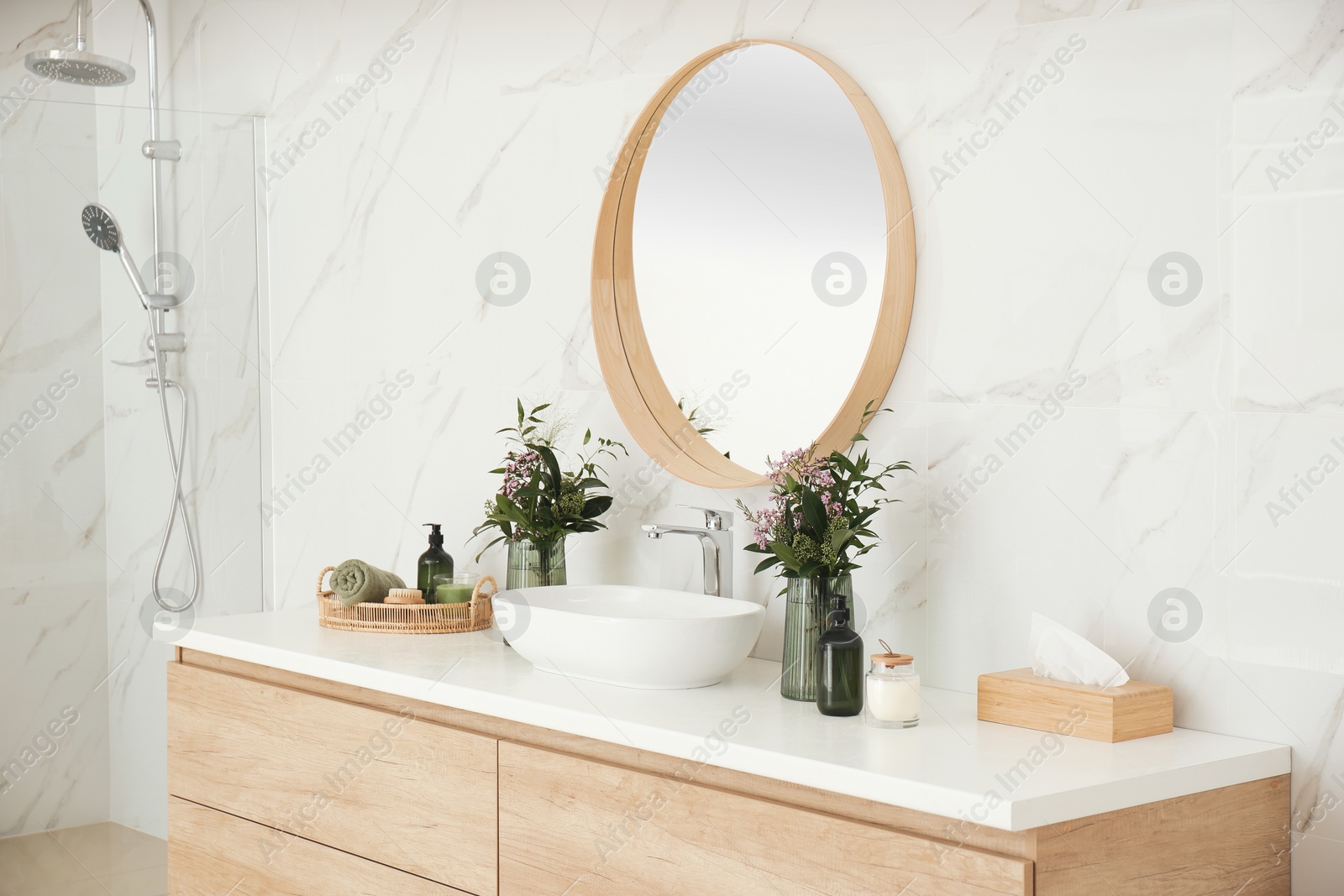 Photo of Modern bathroom interior with stylish mirror and vessel sink